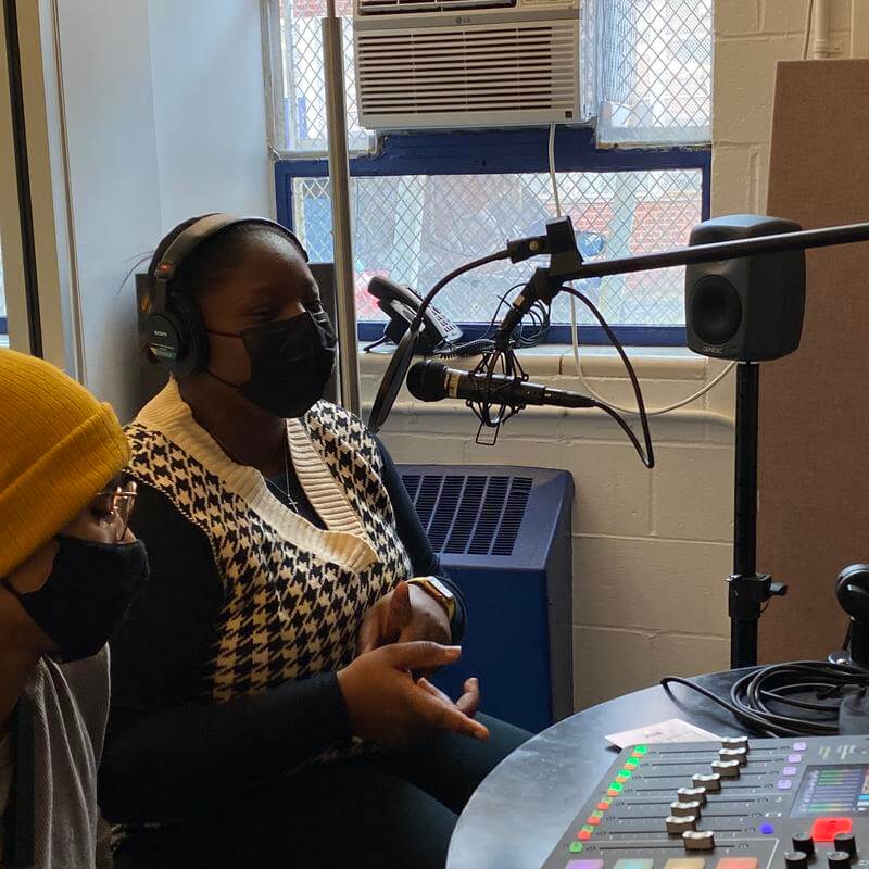 Two audio production students in recording studio