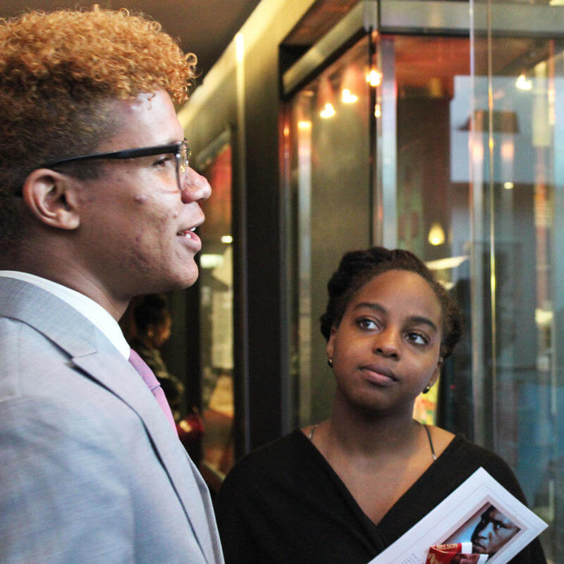 Two HU MJF Students stand in lobby at AFI Theater for the 2017 Paul Robeson Student Awards