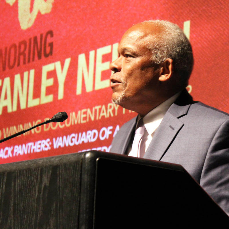 Stanley Nelson at podium with microphone during the 2017 Paul Robeson Student Awards