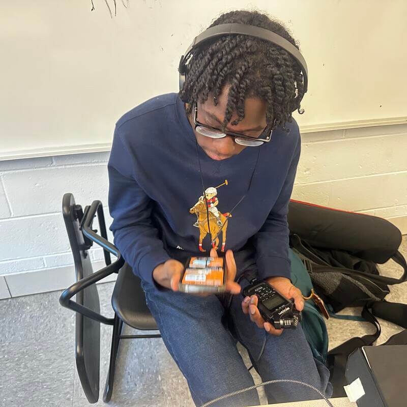 HU Film and TV student seated with zoom recorder