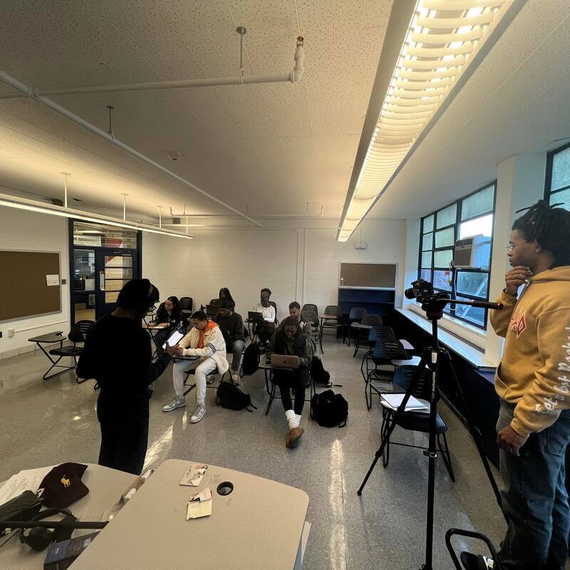 HU Film and TV students in classroom with camera for production