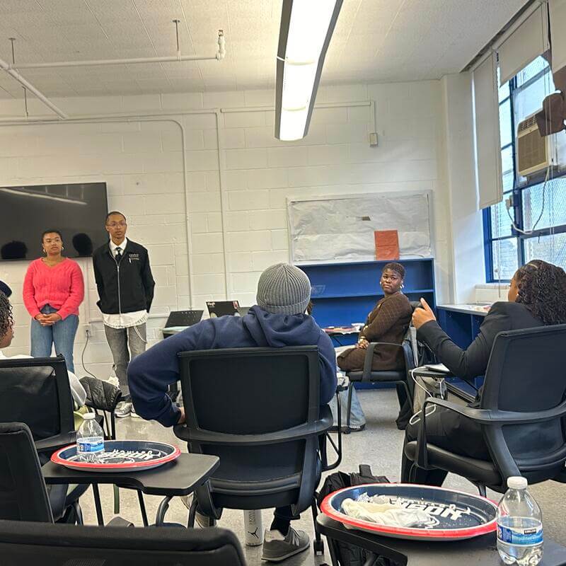 AHP Seniors standing in front of room and answering questions