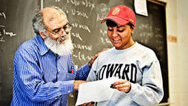 A professor engages with his student.